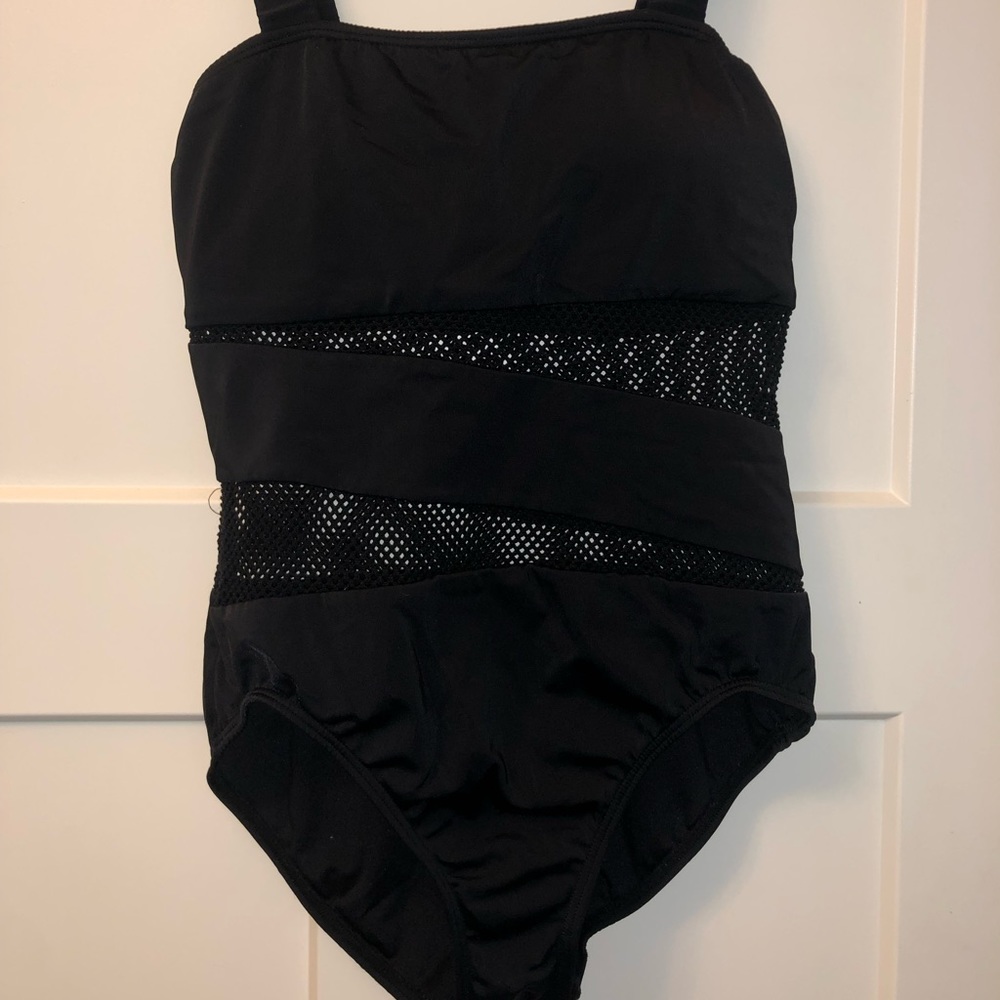 Black one piece bathing suit with fishnet styled sections.